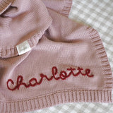 Hand-embroidered baby blanket in blush