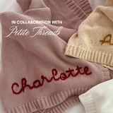 Hand-embroidered baby blanket in blush